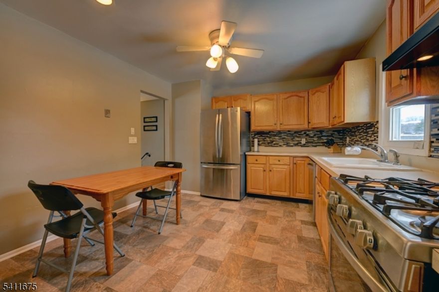 Welcome to one of the larger bi-levels for sale in the community with square footage of approx. 2200 sq. feet, Entire main level has hardwood floors, with exception to the  kitchen. Main bedroom with ensuite, and a newer full bath off the hallway, and 2 additional sizeable bedrooms. Lots of closet/storage space. Roof redone in 2023 when solar panels which are owned were installed. Full bedroom, and family room, laundry room and 1/2 bath are on the ground level with sliders to yard. Close to shopping, dining, highways, schools and entertainment. Must see. This home will sell quickly.