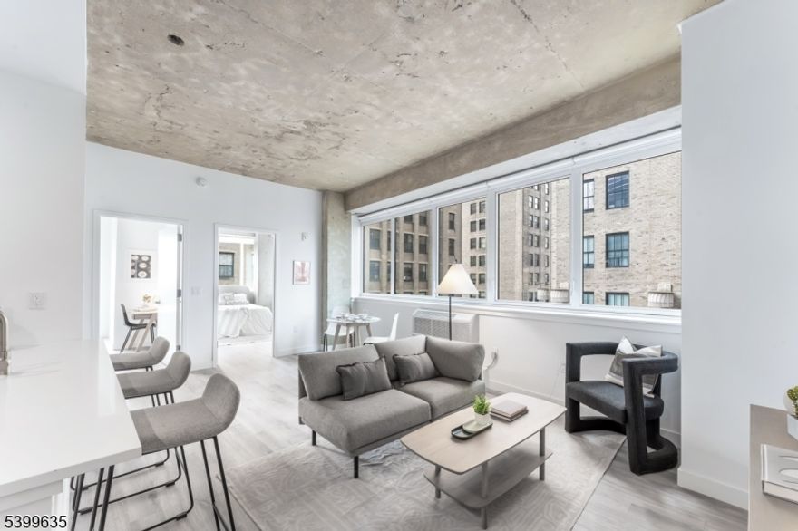 Experience Elevated Urban Living at Newark's Newest Luxury Mid-Rise. Welcome to The Mercer: a refined blend of industrial chic and modern comfort in the heart of Newark, NJ. This luxury mid-rise community redefines city living with spacious layouts, soaring ceilings, and striking exposed concrete accents that create an unmistakably upscale, urban aesthetic. Each beautifully designed residence features in-unit washer and dryer, sleek stainless-steel appliances, including a dishwasher, and oversized windows that flood your home with natural light. Thoughtful finishes and smart layouts ensure comfort, convenience, and style in every square foot. Step beyond your front door and enjoy an unmatched suite of amenities: State-of-the-art fitness center for daily workouts Co-working lounge perfect for remote work, collaboration, or quiet focus On-site caf, offering the ideal spot to start your day or unwind in the afternoon. This growing community is only getting better. Soon, residents will enjoy a full-service restaurant and an expansive roof deck, designed to offer stunning views and vibrant social spaces right at home.Perfectly situated near Newark's cultural destinations, transit hubs, parks, and dining, this building offers the ultimate blend of luxury, lifestyle, and location.Discover the next level of modern living right here in Newark.