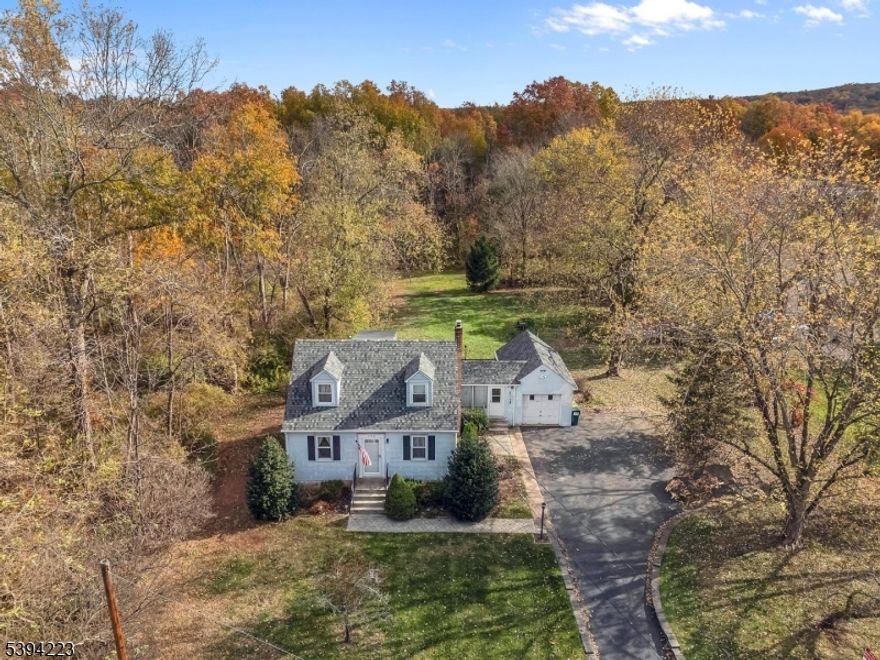 Bring Your Vision to This Classic 4-Bed, 2-Bath Home!  First time on the market in nearly 60 years! This well-loved home is ready for its next chapter and offers tremendous potential for the right buyer. The first floor features an eat-in kitchen with access to the deck, a comfortable living room, two bedrooms, and a full bath. A breezeway conveniently connects the home to the attached garage. Upstairs, you'll find two additional bedrooms and another full bath. The basement provides generous storage space along with a sump pump and oil tank. With its solid layout and inviting setting, this diamond in the rough is a wonderful opportunity to create the home of your dreams.Washer, dryer, refrig, and dishwasher included - Septic size and age is unknown.