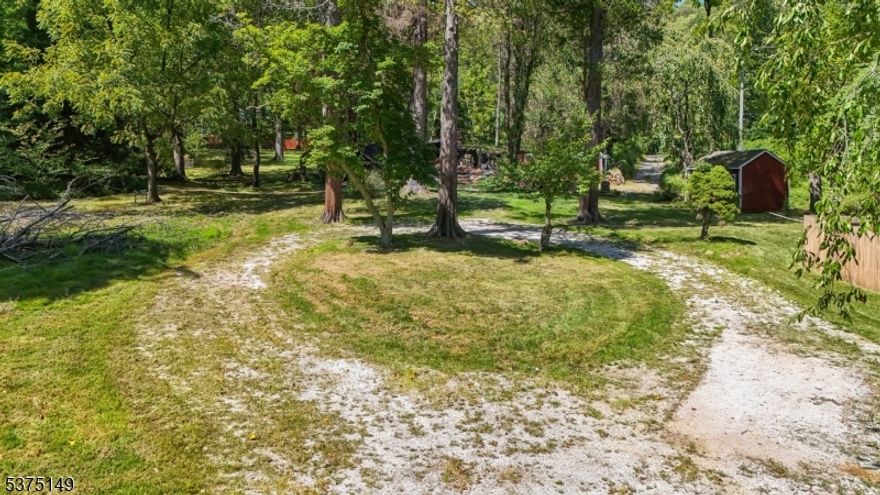 RARE FIND- VALUE IN LAND- The Main Cottage on the 3.49 acres with plans for completion. Due diligence required- In addition, Absolutely Beautiful Setting & Redevelopment Opportunity to Build on 3.49 Scenic Acres w Utilities in place, with a 5 bedroom new septic system, electric, Oil Tank Above Ground & Well Water connected. Fabulous opportunity to own in a highly sought-after location. TRUE VALUE IS IN THE LAND; property also offers tremendous BONUSES, including a state-of-the-art 2024 / 5 Bedroom septic system with the original design survey, and two framed cottages with great potential. Set on 3.49 scenic acres, the grounds feature mature willow and cherry trees, a tranquil pond, and a babbling brook, creating an idyllic natural setting. Fire-damaged structure approved by township for removal prior to closing by seller- Leaving a fully improved lot ready for your vision. Additional structures include a gravel circular driveway, shed & barn stall, adding both functionality and charm. Perfectly situated just minutes from Route 78, downtown Clinton, and Whitehouse Station, the property also offers quick access to Round Valley and Spruce Run Reservoirs, Stanton Ridge CC, and top-rated Readington schools. Whether you are a custom homebuyer, builder, or investor, this property provides a rare chance to redevelop in one of Hunterdon County's most desirable areas. Offered AS-IS -Buyer Responsible for Due Diligence on cottage structure, Rebuilding & Zoning for a new structure.