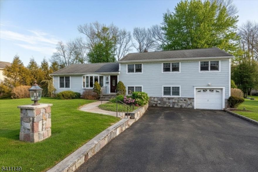 Welcome to this beautifully expanded split-level residence offering exceptional space, thoughtful upgrades, and flexible living designed for today?s lifestyle. Featuring 5 bedrooms and 3.5 bathrooms, this home blends timeless design with modern functionality, highlighted by narrow oak hardwood floors, crown molding, and oversized Andersen windows that fill the home with natural light.The inviting living room centers around a gas fireplace and stunning bay window, seamlessly flowing into a formal dining space ideal for entertaining. The heart of the home is the sun-filled quartz kitchen, complete with skylights, stainless steel appliances, tile flooring, Lazy Susan cabinetry, pull-out drawers, and a spacious center island with built-in microwave ? creating the perfect setting for gatherings both large and small. The primary suite offers a private sitting area, dual closets, and a convenient half bath, while additional bedrooms provide custom storage solutions and access to updated bathrooms. The finished lower level presents endless possibilities with a family room, bedroom, full bath, and laundry area ? ideal for guests, a private suite. Outside, Hardy plank siding, a paver walkway, sprinkler system, patio, and beautifully landscaped grounds enhance the home?s curb appeal, while mechanical upgrades including 3-zone gas heat and a water softener add comfort and efficiency. A rare opportunity to own a spacious, flexible home designed for modern living and lasting style.