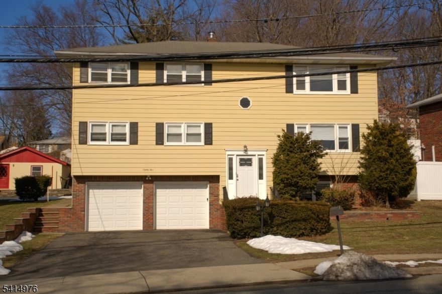 Wonderful opportunity to own a well-maintained two-family home in Hawthorne. This property offers spacious layouts and excellent functionality for both owner-occupants and investors.Large two-family home with basement and separate utilities, offering an excellent opportunity for both owner-occupants and investors in desirable Hawthorne. Unit 1 features 2 bedrooms and 2 full bathrooms with hardwood floors and an open floor plan. The layout includes a large living room, a bright dining area, and a spacious kitchen with ample cabinet space.Unit 2 offers 3 bedrooms and 1 full bathroom, along with a spacious dining room, large living room, and generously sized kitchen. Hardwood floors and comfortable room sizes create a functional and inviting living space.Additional highlights include a two-car attached garage and a full basement with separate laundry hookups for each unit, as well as a large storage area that offers potential to be finished for additional living or recreational space.The property also features a large private rear yard, gas heat, central air, and large rooms throughout. Ready to add your touches Conveniently located near the Glen Rock and Ridgewood borders, with easy access to NJ Transit, major roadways, parks, dining, and shopping, offering excellent accessibility for commuting and daily living.