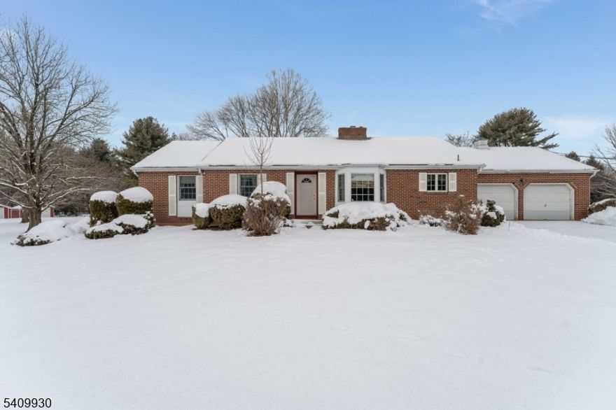 Welcome Home to this inviting 3-bedroom, 2-full-bath Ranch nestled on a picturesque 1.93-acre property in Readington Township. This home offers the perfect blend of comfort, space, and potential.  Step inside to discover spacious rooms enhanced by beautiful hardwood flooring and updated lighting throughout. Sunlight pours in through quality Anderson Windows, creating a warm, bright atmosphere in every corner of the home. The living room serves as a cozy gathering space, complete with a charming wood-burning fireplace with built in shelving perfect for relaxing evenings.  A separate entertaining space provides additional flexibility for entertaining, formal dining room and large eat in kitchen with updated cabinetry complete the living space. The thoughtful layout ensures both functionality and easy one-level living including main floor laundry.  The unfinished basement presents an excellent opportunity to expand your living space ideal for a recreation room, gym, workshop, or storage plus the home also has an attached 2 car oversize garage with inside entrance to the kitchen.   Outside, enjoy the privacy and serenity of nearly two acres, offering endless possibilities for outdoor living, gardening, or simply enjoying nature.  This property is a wonderful opportunity to enjoy Ranch-style living with room to grow in a desirable location.  Home being sold in as-is condition.  Professional Photos to come.