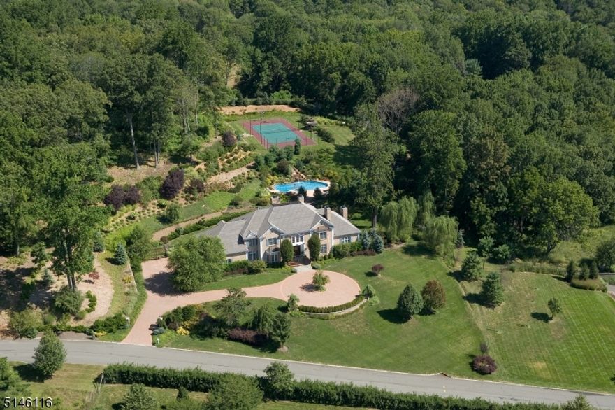 Stunning custom home filled with tons of natural sunlight located on one of the most prestigious streets in the eastern side of Mendham Twp. This home commands attention with extraordinary terraced grounds, patio with wisteria-covered pergola, level property, heated salt water inground pool with waterfall and lighted sports court.  Exquisite ornamental moldings, hardwood flooring with inlays, bay windows, five fireplaces, recessed lighting throughout home. Choice of two primary bedroom suites (first and second floor) with fireplaces, walk-in closets and luxurious full baths, three additional en-suite bedrooms on second floor and sixth bedroom or office on first level. Front and rear staircases, two-story great room and entry, 10 ft ceilings on first floor, second floor laundry and a walk-up attic. Sophisticated library with built-ins, fireplace, transom windows and two French doors; Formal Dining Room with butler's pantry, two powder rooms, great room with wet bar and French doors leading to outside paradise  Kitchen offers an oversized center island with sink and six-burner gas cooktop, double ovens, granite counters, wood and glass cabinetry, Sub-Zero refrigerator and separate eating area. Steel beam construction, silent floor joist system, 3 gas-fired furnaces, central vacuum system, 32 zone underground sprinkler system, paver circular driveway, 14 course basement, five bedroom septic system   Absolutely lovely!