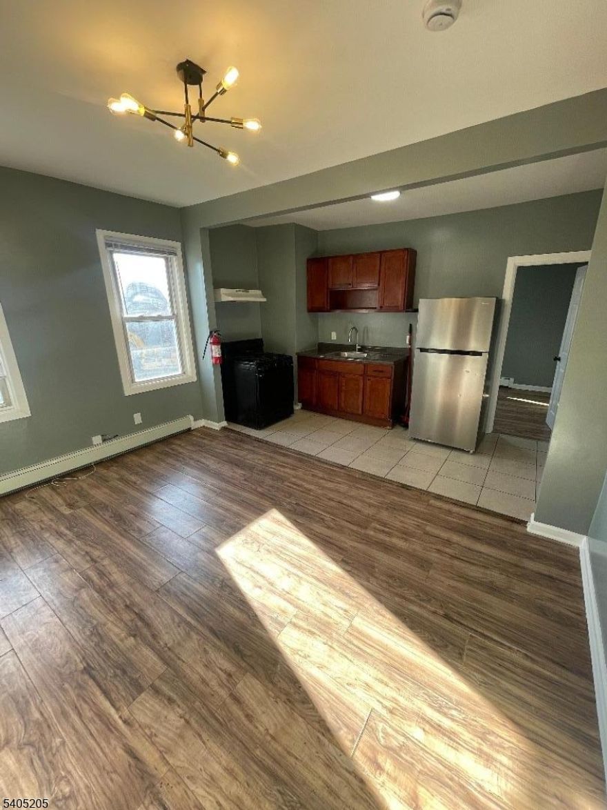 Welcome to this inviting two-bedroom apartment located at 377 S 10th Street in Newark, NJ. This well-proportioned home offers a comfortable layout featuring a spacious living area, two generously sized bedrooms, and a functional kitchen ideal for everyday living. Natural light enhances the space, creating a warm and welcoming atmosphere throughout. Conveniently situated near local shops, restaurants, public transportation, and major highways, this apartment provides easy access to everything Newark has to offer. An excellent option for those seeking comfort, convenience, and city living.