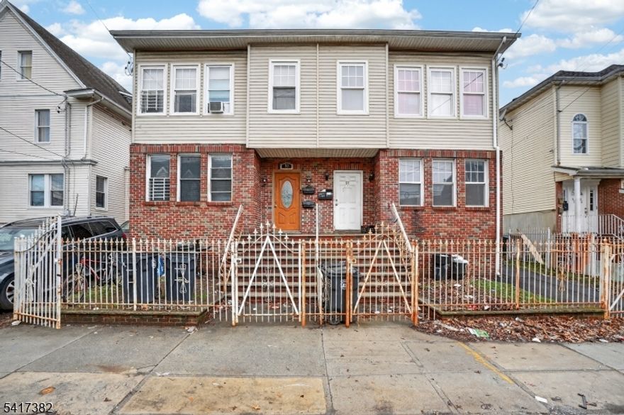 Well-maintained 2-family home at 97 Clinton Place, Newark offering great investment or owner-occupant potential. Each unit features 3 spacious bedrooms and 1 full bathroom, with beautiful wood floors throughout. Enjoy charming architectural details including French doors in the living rooms and elegant arched doorways leading into the dining rooms. The kitchens are equipped with walk-in pantries, providing ample storage space. Coveted off-street parking adds to the home's appeal. The top-floor unit is currently rented, offering immediate income opportunity.