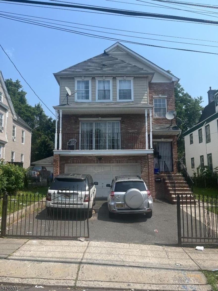 Discover an exceptional investment opportunity with this expansive 2 unit residence with bonus space, ideally situated on an oversized lot just steps from I-78, the Garden State Parkway, and key transit options. Boasting impressive square footage and a prime location near downtown Newark, this property is perfectly suited for both owner-occupants and seasoned investors seeking strong rental potential. Each of the three generously sized units features high ceilings, abundant natural light, and versatile floor plans that offer both comfort and character. The rare, extra-large lot provides valuable outdoor space ideal for private parking, gardening, or future enhancements making it a true asset in an urban setting. Located within walking distance to NJ Transit, major highways, parks, retail centers, and educational institutions, this home stands out as a premier multi-family. Don't miss this rare chance to own a high-performing property with endless upside in the heart of the city.