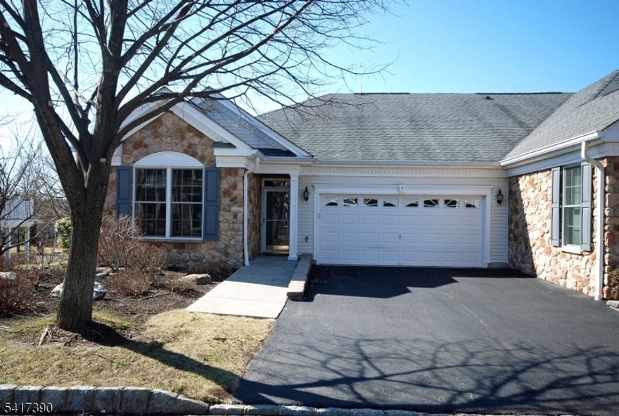 Finally, a RIESLING Villa (end location) is available in this 55+ PREMIER GATED COMMUNITY!    Everything you need is on one level filled with windows and natural light.  An artistic touch is evident throughout this home complemented by the architecturally pleasing ceilings. An impressive primary bedroom suite w/two walk-in closets, sitting area & luxurious bathroom w/jetted tub.   Featuring upscale lighting, built-in shelving, custom blinds, solid wood Murphy bed & wardrobe closet, two-car garage w/storage and balcony w/sunset views.   Resort style living with a 25,000 sq. ft. clubhouse w/the BEST amenities: indoor & outdoor pool, tennis/pickleball, card rooms, Mahjong, putting/driving, fitness center, grand ballroom, clubs, activities & more.   Bordering Montclair with terrific restaurants, shops & boutiques.   Very short distance to NYC Bus & Train Station.  A delightful lifestyle is here to enjoy!