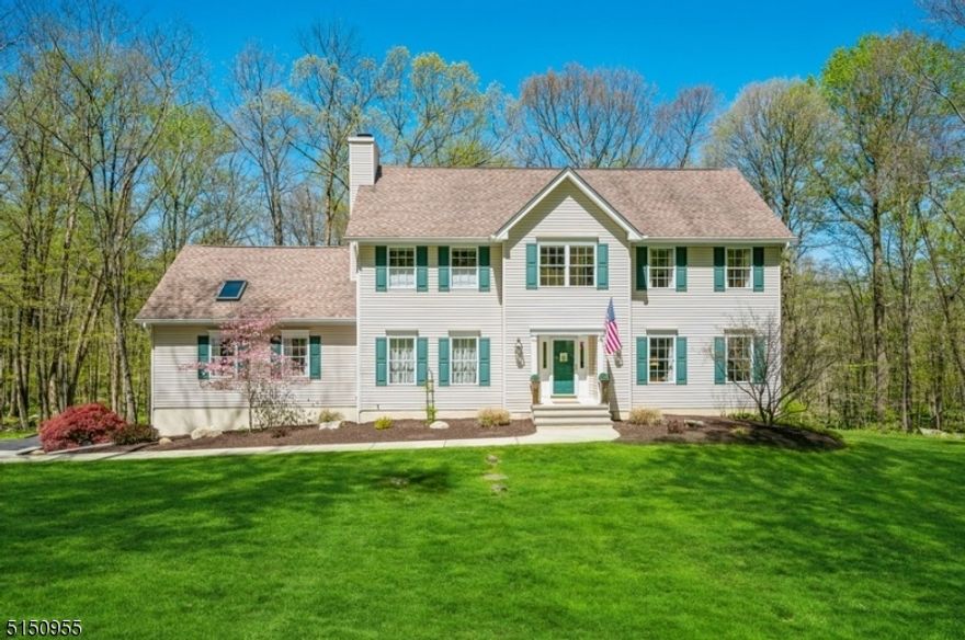 A private, light-filled haven with stunning curb appeal! Spacious Colonial boasts 4BD/3BTHs, a porch, and a deck w/scenic views set on 5 tranquil acres in an ideal residential neighborhood. This beautifully manicured property includes an attached 2-car garage & sweeping front & back lawns. Further out you can see the start of the woods. This home offers a warm, inviting atmosphere beginning w/the freshly landscaped front entry & continuing inside to an impeccable interior featuring hardwood flrs, beautifully scaled rms, generous light & contemporary finishes.The large, bright foyer w/a graceful, quarter-turn staircase opens to the LR and the formal DR perfect for entertaining w/an elegant chair rail & crown molding. Off the LR is a sun-filled ofc. The well-appointed kitchen is updated w/crisp white cabinets, high-end appliances, granite counters, a center island & a breakfast nook. Sliding glass doors open to the deck overlooking the lush green grass bordered by mature trees. The spacious FR has a vaulted ceiling w/skylights & a fireplace w/a beautifully carved wood surround & mantel. French doors open to a delightful screened-in porch. A full Bth & laundry rm complete this level. The 2nd floor features the luxurious primary suite with a WIC & spa-like en-suite BTH, 3 additional BDs, a bright loft & a hallway BTH w/ a convenient laundry chute. The basement level offers ample storage space, a walkout to the patio & endless possibilities. Hookup Generator. Industrial Gutters.