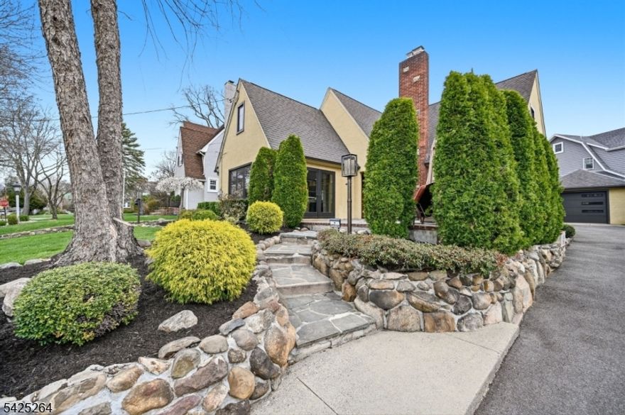 "Beautiful" and "Meticulous" are understatements for this bespoke Glen Rock residence. Every inch of this home has been intentionally curated, merging period charm with a high-level, contemporary renovation. The exterior sets a commanding tone with a striking redone stone wall and manicured grounds. A welcoming paver patio perfect for morning espresso or evening cocktails features French doors that lead seamlessly into the heart of the home. Inside, the open-concept flow is designed for effortless entertaining, anchored by a chef's kitchen and a dining area featuring stunning herringbone hardwoods and custom built-ins. The living room serves as a sophisticated retreat with a gas stone fireplace, Lutron-controlled lighting, and automatic window treatments. The first floor is completed by a serene bedroom and an impressive full bath showcasing exquisite Porcelanosa tilework. Upstairs, the layout offers ultimate versatility: a flex space with a wall of storage, a primary bedroom with dual walk-in closets, a third bedroom, a dedicated home office, and a spa-like bath with a custom vanity and glass stall shower. Finished with white oak floors throughout and a spacious basement for storage, this is a rare opportunity for a turnkey lifestyle in one of Bergen County's most sought-after communities. Boiler 5 years, AC 4 years.