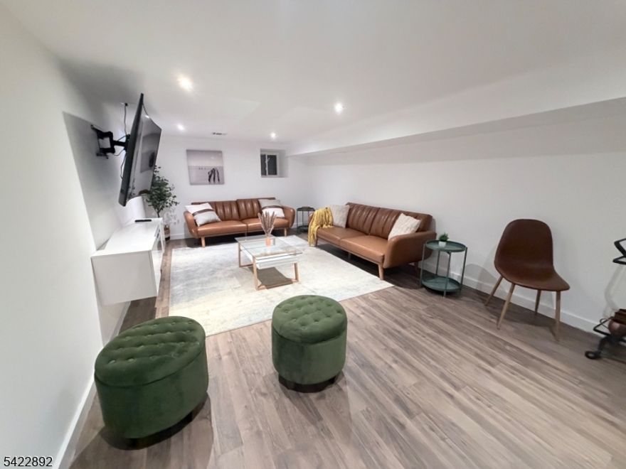 Welcome to this exceptional, fully renovated two-family residence offering refined living, modern design, and outstanding versatility. Each unit is thoughtfully designed with spacious layouts, elegant finishes, and abundant natural light throughout. The first-floor unit features 3 generously sized bedrooms, complemented by a seamless flow between the living room, formal dining room, and a beautifully appointed eat-in kitchen, perfect for both everyday living and entertaining. The second-floor unit offers 3 bedrooms plus an additional leisure room in the finished attic, ideal for a home office, media lounge, or guest retreat adding a unique and flexible living space rarely found. Enhancing the home is a fully finished basement, providing additional living or recreational space with endless possibilities. Ideally located near major highways, public transportation, parks, and top-rated schools, this property offers both luxury and convenience, making it perfect for owner-occupants or savvy investors seeking strong income potential.