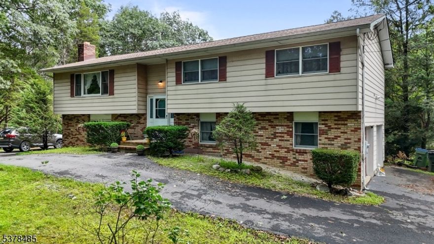 Set on 1.96 acres of peaceful countryside, this 4-bedroom, 3-bath bi-level home offers the perfect combination of space, comfort, and opportunity. The upper level features a sun-filled living room, a dining room that flows easily into the kitchen, and three generously sized bedrooms, including a primary suite with its own bath. A second full bath completes this level. The lower level is ideal for guests, with a private bedroom, full bath, laundry area, and kitchenette. A spacious family room provides the perfect spot for movie nights, gatherings, or game days. Step outside to enjoy warm-weather living on the deck, cool off in the above-ground pool, and take in the scenic countryside setting. The oversized 2-car garage offers abundant space for parking, storage, or hobbies. Recent updates include a brand-new roof (2024) and a new hot water heater, offering peace of mind for years to come.  Conveniently located minutes from Swayze Mill Park and close to major routes, shopping, and dining, this home delivers small-town charm with commuter convenience. With nearly 2 acres of land and versatile living spaces, this property is ready to welcome its next Owners to create the lifestyle they've been looking for.