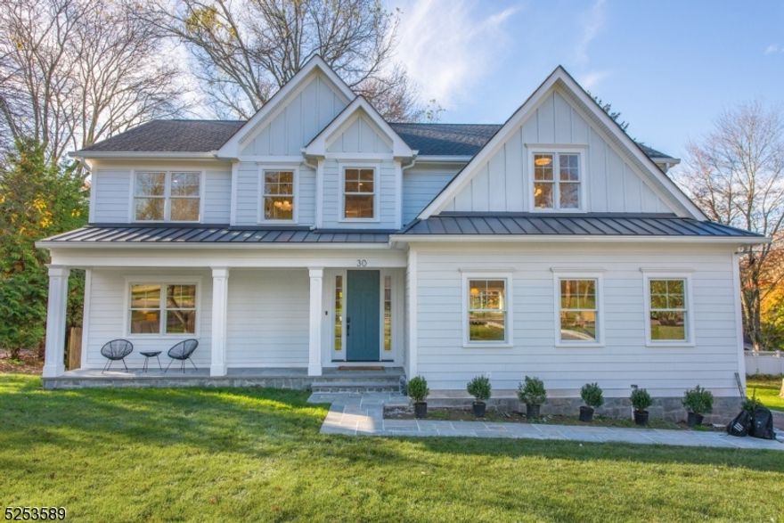 This exquisite home offers a fantastic layout and impeccable craftsmanship, catering to those seeking a luxurious suburban lifestyle. Featuring a modern Colonial design, this 5 BR, 5.5 BA home seamlessly combines an open floor plan with soaring ceilings and top-of-the-line finishes. The heart of the home is the Chef's kitchen, boasting custom cabinetry, designer appliances, and a spacious center island that effortlessly flows into the family room with a cozy fireplace and a stylish dining area.The first floor provides a spacious in-law suite, ensuring comfortable living arrangements. Additionally, you'll find a welcoming dining room, a convenient powder room, and easy access to a deck, perfect for outdoor entertaining. As you ascend to the upper level, you'll discover a luxurious primary suite, a junior suite, two additional bedrooms accompanied by a well-appointed hall bathroom, and a laundry room for added convenience. The lower level of the home has been beautifully finished and offers a versatile recreational room, a practical mud room, a full bathroom, and direct access to the garage. This home effortlessly combines elegance, functionality, and the epitome of modern living.