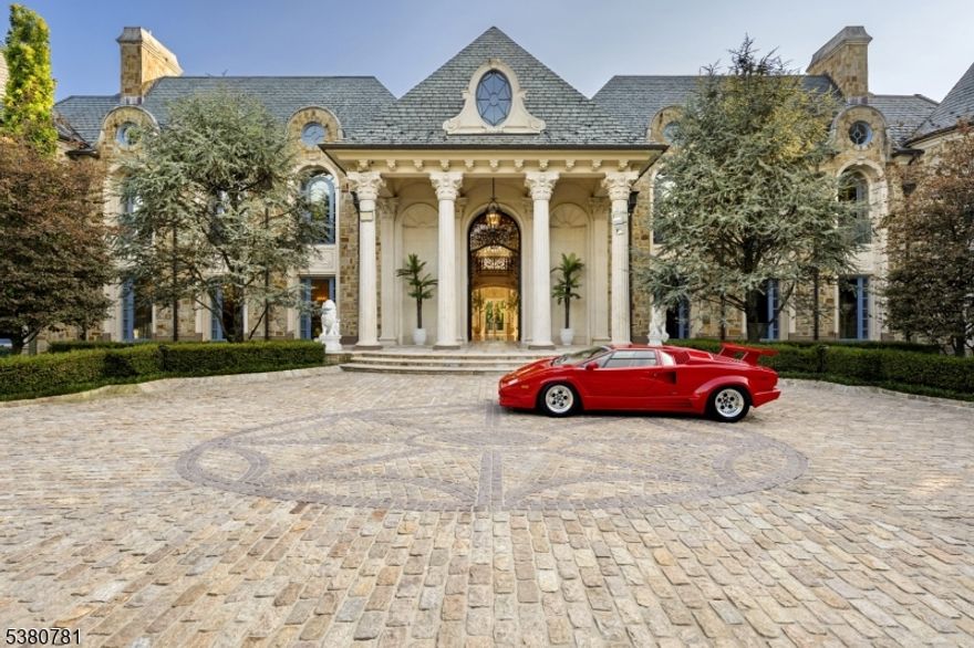 In Alpine's most coveted enclave, where prestige meets perfection, 31 Rio Vista Drive rises as a rare statement of architectural artistry and uncompromising luxury. Set on two manicured acres behind stately gates, this 2017-built estate spans nearly 21,000 sq ft and commands attention with a dramatic bridge marble staircase, custom wood floors, and heated marble underfoot. From the private elevator connecting the basement to the roof deck, to the state-of-the-art custom kitchen, every element is meticulously crafted. Venetian plaster walls add timeless texture, while nine fireplaces, custom closets, and spa - inspired baths offer unmatched comfort. More than nine A/C units and solar panels ensure modern efficiency without sacrificing elegance.