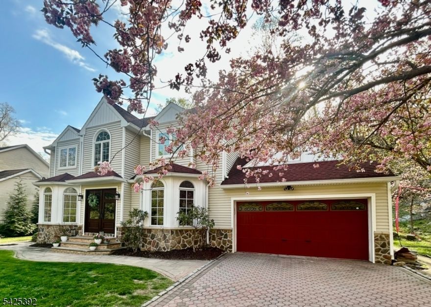 Refined Living with Direct Woodland Access in the Heart of Denville. Experience elevated living in this exceptional 4-bedroom, 2-bath residence at Rock Ridge Lake community. Perfectly positioned to capture serene views of Jonathan Woods   with direct access for hiking right from your property, this home offers a rare blend of privacy, natural beauty, and refined comfort.Inside, warmth and timeless character define the living spaces, highlighted by a classic wood-burning fireplace ideal for cozy evenings and elegant entertaining. The home seamlessly blends charm with modern convenience, featuring newly installed premium appliances including a dishwasher, refrigerator, oven/range, washer, and dryer.Step outside to your private retreat where a hot tub overlooks tranquil woodland scenery, creating a spa like escape in your own backyard.Significant upgrades enhance efficiency and curb appeal, including a new furnace (2022), several new windows, and a beautifully remodeled front exterior completed in 2023, delivering a sophisticated and impressive first impression.Beyond the property, enjoy all that Denville has to offer   top-rated schools, a vibrant downtown filled with boutique shops and acclaimed restaurants, lake community living, and a convenient commute to NYC via nearby train and major highways. This is a rare opportunity to enjoy refined living, direct access to nature, and the charm and connectivity of one of Morris County's most sought-after towns.