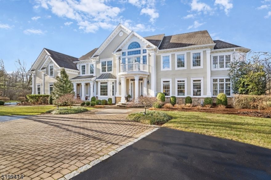This magazine-worthy custom colonial home is impeccably maintained with all of the features one would expect from a home of this caliber. The architectural details such as exquisite millwork, 10 ft ceilings, transom windows & hardwood floors create a truly magnificent home. An exceptional kitchen with top of the line appliances includes Wolf, Sub-Zero and U-Line. The expansive granite island, custom cabinetry & breakfast area is sure to please the most discerning buyer. The Family Room boasts soaring ceilings, a wood burning fireplace & an abundance of natural light. The first floor offers so much space with additional rooms for work, music & play. This beautiful home with just under 5200 SF is a must see. The second floor is where all of the bedrooms including the spacious bonus room/5th bedroom are to be found. Within the impressive Primary suite you will find a sunlit sitting room & stunning new bathroom featuring quartzite, dual sinks & a modern soaking tub.  With a media room, gym area, play area & wet bar, the finished LL offers an additional 1800 SF & provides a wonderful space to hang out & relax/workout. One can also choose a nice vintage from your very own wine room! A circular driveway, Hardie Plank, Azek finishes, detailed trim work, generator, sprinkler, mahogany deck, bluestone patio, prof landscaping with elegant lighting, oversized 3 car garage & 1st floor laundry complete this one of kind home on 2.5 acres in the Oak Street section of beautiful Basking Ridge.
