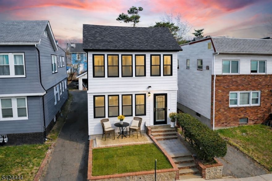 Fully renovated from the studs up, this reimagined 2-family home offers the perfect blend of style, flexibility, and smart ownership potential in East Orange. Each unit features open-concept living/dining, beautifully updated kitchens with stainless steel appliances, modern baths, and split-unit systems providing both A/C and heat. Thoughtfully upgraded beyond the surface, this property includes all new and upgraded electrical with 2 panels, 2 tankless high-efficiency water heaters, 20 hard-wired smoke detectors, laundry hookups, detached 2-car garage, and a finished basement with French drains all around. A total of 9 split units provide year-round comfort, with 2 in the basement, 3 on the first floor, and 4 on the second floor. Stainless steel appliance package includes 2 refrigerators, 2 range stoves, 2 microwave ovens, and 2 dishwashers. Ideal for owner-occupants, investors, or buyers seeking flexible living options. Conveniently located near parks, shopping, major highways, and transportation. A rare opportunity to own a beautifully rebuilt multi-family with meaningful upgrades throughout.