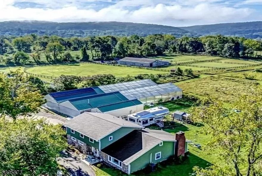 ***TRANQUIL HAMPTON (LEBANON TOWNSHIP) HOMESTEAD & FARM w/ AQUACULTURE & HYDROPONIC 7800+ SQ FT GROWHOUSE & GREENHOUSE on 6.38 FARM ASSESSED ACRES w/ 4 BED 2.5 BATH COLONIAL HOME w/ ATTACHED 2 CAR GARAGE OVERLOOKING PASTURE & LIGHT WOODLANDS*** Truly the total package! Cozy 4 bedroom, 2.5 bath FULLY RENOVATED HOME w/ attached 2 car garage! The 1st floor showcases: formal entry foyer w/ custom barn door accent closets; formal tiered LR/DR combo w/ gorgeous built-in bookcase; farmhouse kitchen w/ commercial elements for all your cooking & baking needs; an oversize family room w/ WB stove; laundry/mud room; half bath & climate-controlled storage room. The spacious 2nd floor hosts a primary bedroom suite w/ WIC & full bath w/ shower; 3 bedrooms; & a hallway full bath plus addtl attic access for extra storage or future living space. Step outside on the patio & enjoy the scenery of a boutique farm where the DETACHED GROWHOUSE & GREENHOUSE takes the prize! Building facilities showcase: 3 zone heat; radiant heat system; 400 amp electric infrastructure; solar system; office/store & storage area! Truly functional farm amenities for aquaculture & hydroponics! Unlimited agricultural potential for a small vineyard, herbary, apiary, heritage livestock farm, heirloom produce farm & more. Potential for horses too! Minutes to commuter routes make this property truly accessible...equidistant to greater NYC & metro Philadelphia ! Experience quiet country living at this turn key farm property!