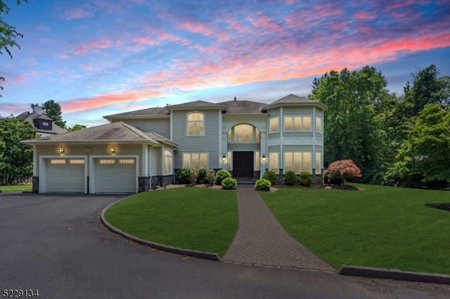 The ONE YOU HAVE BEEN WAITING FOR!!! Welcome to this EXTREMELY PRIVATE colonial home, offering 4 beds 4.5 baths, and over 6,500 sq ft of luxurious living space. The beautifully landscaped property spans over half an acre creating ample outdoor fun and living. Situated on a secluded cul-de-sac, this home boasts privacy and spectacular country club views surrounded by beautiful trees. Step inside to a two-story entry that leads to a library, a formal living room, and a dining room. The oversized chef's kitchen with an island is adjacent to the expansive breakfast area and family room, featuring lofted ceilings, a fireplace, and built-ins. All of these spaces overlook the well-landscaped patio and backyard, complete with a pool. The oversized primary suite is a true retreat, offering a sitting room,  two closets, and a luxurious bath. The front and back staircases lead to an ensuite bedroom with a private bath, as well as two additional bedrooms with a Jack and Jill bathroom, completing the second floor. The lower level of this home is fully finished, providing a large recreation area, gym, office, full bath, and abundant storage space. Enjoy the spaciousness of the enormous 2-car garage, which comfortably accommodates up to 3 cars with ample parking in the driveway.  With its private location, impressive size, elegant features, and stunning views, this home offers a truly exceptional living experience.