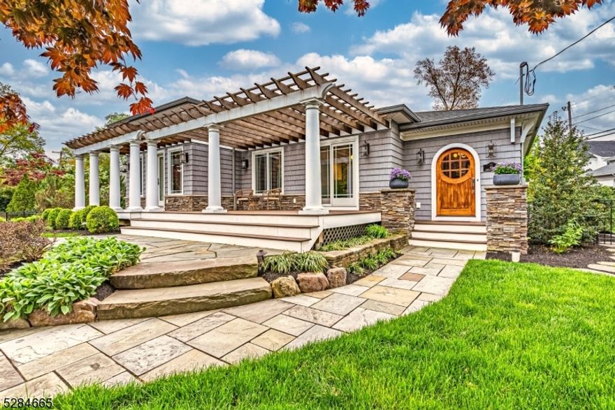 Beautiful, Sprawling, Updated Ranch in the desirable Indian Lake community! Step into this secret garden through a wooden arch & gorgeous gates. Fabulous Open Living Space. Large, Welcoming Foyer w/Unique Arched Wooden Door welcomes you in to the living room w/tray ceilings & a STUNNING stone faced gas fireplace. Bright Kitchen w/Granite Counters & High End SS Appliances. Center Island, Bar Seating, Glass tiled backsplash & open wooden shelves. Dining area w/french doors lead to composite deck & pergola which eases the transition from living indoors & out. 2 toned cabinets & brass hardware carry the charcoal & white tones throughout the home. Freshly painted. New, modern HW flooring & solid custom wood doors w/crystal door knobs throughout. Gorgeous light fixtures compliment the design w/gold & black finishes. 3 generous sized bdrms equipped w/lots of closet space. A grand & indulgent primary suite showcases high ceilings, automatic blinds, a custom walk-in & bath w/an oversized spa shower. Flexible Finished BSMT. Family room, wet bar, laundry & 3rd full bath. 2 Car Garage & TONS of storage! Stunning landscaping & so many extras completed w/quality craftsmanship. Cross the street & paddle to all Clubhouse & Beach Activities. Stones throw from diving board beach & Bistro. You can't beat the location. Convenient to everything! Just mins to public transportation -NYC-Direct train & bus, major hwys, grocery store & great restaurants/shopping in DWTN Denville. NOT IN FLOOD ZONE.