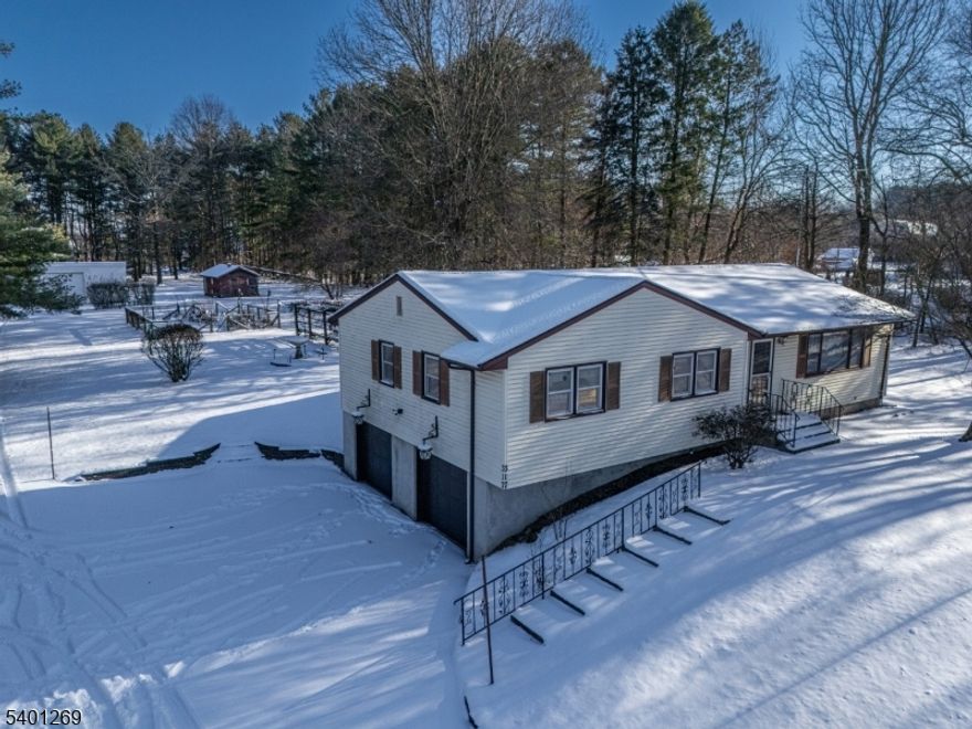 What a GREAT Opportunity to own a lovely 3 BR, 2 Full Bath home Nestled on a GORGEOUS 1.67 Acre Lot within the Gently Rolling and Scenic Hills of Highly Sought After HUNTERDON County! This sweet home boasts all HARDWOOD flooring on the main level, a partially finished Lower Level, an Expansive HEATED Sunroom and Incredible OUTBUILDINGS! Main Lvl: Entry Foyer, LR, DR, Eat-in Kit w/Pantry, 3 BR's, 2 FULL Baths & Huge HEATED Sunroom! Sunroom has SKYLIGHTS, FANS & HEAT! PULL-DOWN to Attic! Lower Level: REC RM (formerly Seamstress shop) with Drop Ceiling, Fluorescent Lighting & Separate HEAT, a laundry/utility/storage area and the 2 Car BUILT-IN GARAGE! Gar w/ELECTRIC Openers! There is a 29'X22' All Block WORKSHOP/Garage with a STEEL I-BEAM, ELECTRIC, HIGH Ceiling, HIGH Overhead Door, a HOIST and two HEAT Options (oil burner and/or wood stove) There is also a mini barn/shed with Electric as well! This incredible lot is LEVEL and OPEN yet BORDERED by MATURE Evergreen Trees! It is truly Beautiful! There is a fenced in Garden Area! A PERGOLA with Grapevines, BRICK barbeque, Patio/Walkway and lots of open yard space! LOCATED Just MINUTES to COMMUTER Routes & Most CONVENIENCES! Impressive HUNTERDON CO School District! OUTBUILDING (Incredible ASSET!) is such a rare find & perfect for so many possibilities! This is an ESTATE being Sold Strictly "AS-IS". Buyers responsible for ALL inspections and repairs including well testing, fire safety & UST (in-ground for oil furnace in workshop)