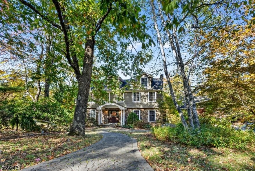 Welcome to 101 Cheshire Lane in Ringwood's sought-after Kensington Woods community. This impressive 5-bedroom, 2.5-bath Colonial offers exceptional craftsmanship, thoughtful upgrades, and a resort-style backyard that elevates everyday living.Step inside to beautifully finished spaces enhanced by hardwood floors, detailed moldings, radiant heated floors in the foyer and kitchen, and abundant natural light. The gourmet kitchen is a true standout, featuring a Sub-Zero refrigerator, Thermador professional stove, built-in Miele espresso machine, built-in refrigerator drawers, and high-end finishes designed for both cooking and entertaining. The home's layout includes multiple living areas, spacious bedrooms, and a primary suite with a walk-in closet, with both second-floor bathrooms also offering heated floors.The finished lower level adds versatility, ideal for recreation, a home gym, or storage. Peace of mind comes with thermal windows and doors, an underground sprinkler system, and a full security system.Outdoors, your private oasis awaits. Enjoy an in-ground pool with waterfall and spa, a fully equipped outdoor kitchen, expansive decking, and a privacy fence perfect for hosting or unwinding.Set on nearly 1.5 acres of manicured property, this home blends luxury, comfort, and tranquility while remaining close to Ringwood's parks, lakes, and commuter routes.A truly exceptional property offering a lifestyle of comfort and elegance your next chapter starts here.