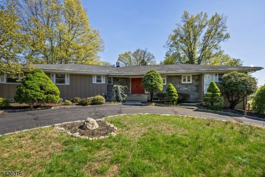 North -facing ,Raised Ranch   Mother-Daughter Potential   Welcome to this beautifully designed raised ranch in the sought-after Copper Hill section of Bridgewater where space, flexibility, and everyday comfort come together seamlessly. A circular driveway sets the tone, offering both curb appeal and convenience.The main level features a bright, flowing layout with a formal living room and a warm, inviting family room anchored by a wood-burning fireplace. Sliders open to a private deck perfect for morning coffee or evening gatherings. The bedroom wing includes a spacious primary suite, three additional bedrooms, and a full bath. A secondary entrance with mudroom, powder room, and laundry adds everyday ease.The lower level expands your lifestyle with a spacious living room area, a private 5th bedroom, full bath, and its own laundry - ideal for extended living, guest space, or private suite setup. Sliders lead to a lower patio overlooking a peaceful backyard. Direct access to the 2-car garage enhances functionality, with additional unfinished space for storage or future expansion.Enjoy seamless indoor-outdoor living with both deck and patio perfect for entertaining or quiet moments at home.Conveniently located near Routes 202/206, 22, 287 & 78, Bridgewater Commons, dining, shopping, and top-rated schools. Approx. 35 minutes to Newark Airport.A rare opportunity offering space, versatility, and a lifestyle designed for how you live today.