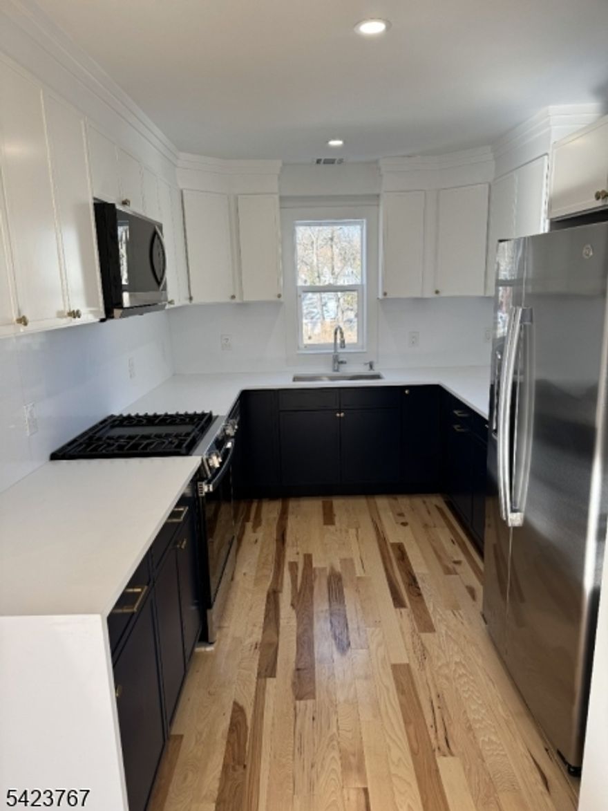 ATTENTION INVESTORS: TENANT IN PLACE & BEING SOLD AS A RENTAL PROPERTY!!!  Quality tenants in place in this like new two-family home. 2 leases in place. One lease recently signed for 2 years at $3,500/month and the other lease is signed at $2300/month and has one year remaining. Yearly Financials: Rent: $69,600 Property Taxes: $9,512, Sewer Costs: $400 Net Operating Income: $58,728 Walk to everything in Morristown location (train, school, downtown). Fully reconstructed home with all new everything. Laundry is private and inside the units. Off Street parking spaces. Top notch insulation and soundproofing in walls and ceilings. Rebuilt masterfully and with great care. Sizable backyard. Bathrooms are spacious with great water pressure from the new plumbing. Good ceiling height with tons of natural light, solid hardwood hickory floors. Kitchen countertops and backsplash are solid quartz and cabinets / vanities are solid wood. This property is being offered as a rental investment with a tenant already in place. The owner is seeking to sell it as part of a rental property package alongside MLS#4020634, MLS#4020635, MLS#4020616. Owner may consider selling individual properties.