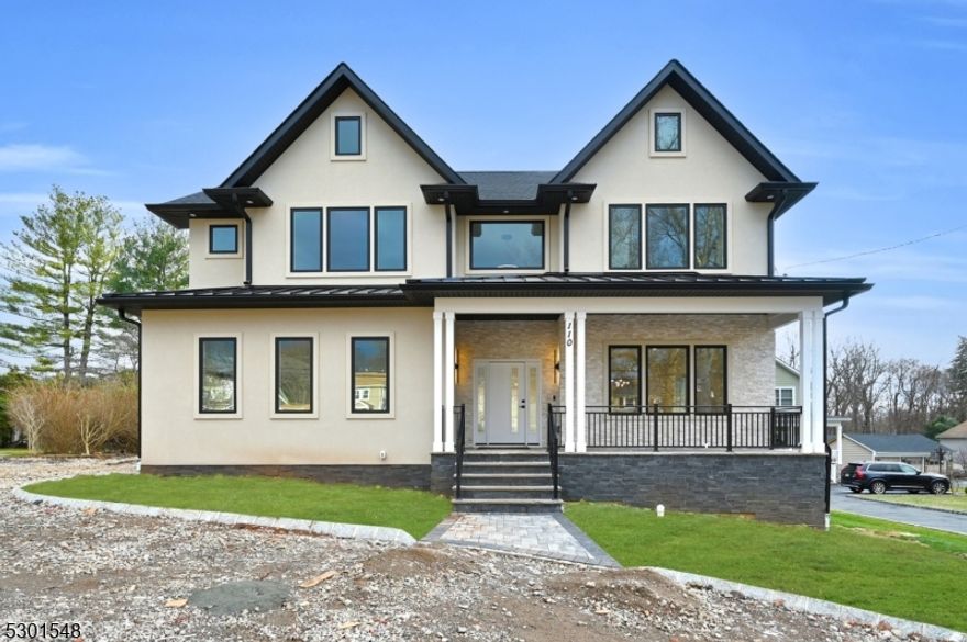 Welcome to this exquisite custom Colonial home, featuring a WALK-UP Basement and a sparkling POOL, on a sprawling 0.7 ACRE flat backyard. This impressive residence offers 6 bedrooms and 5.1 bathrooms across 3 meticulously designed floors, providing appx 5,250 square feet of living space. As you enter through the grand two-story foyer, you will discover formal living and dining rooms ideal for entertaining guests. The chef's kitchen seamlessly opens to an expansive family room. It boasts high-end stainless steel appliances, a large center island, quartz countertops, a butler's pantry, and ceiling-height cabinetry. The first floor includes a bedroom and full bathroom, perfect for multi-generational living. On the second level, you will find four spacious bedrooms, including a luxurious primary suite with two walk-in closets, a private BALCONY, and a spa-like bathroom featuring a soaking tub and dual sinks. Two additional bathrooms and a laundry room complete this floor. The fully finished basement adds versatility with a recreation room, home OFFICE, an extra bedroom, and a full bathroom ideal for hosting guests. Throughout the home, WIDE PLANK hardwood flooring flows elegantly, complemented by exquisite TRIM WORK that enhances its overall sophistication. With a 10-YEAR BUILDER'S WARRANTY and smart home features, this exceptional home beautifully blends traditional architecture with modern amenities for ultimate comfort and elegance.