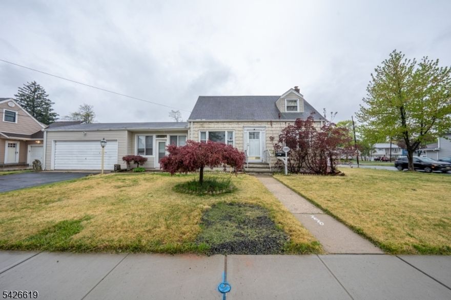 Situated on a well-maintained corner lot, this move-in ready Cape Cod offers a functional and straightforward layout that is ready for its next owners. The main level features a comfortable living room with wood flooring and neutral tones that lead into a dedicated dining area. The kitchen is practical and inviting, featuring cabinet storage, and a cozy breakfast nook area. Two bedrooms and a full bathroom are also located on this floor, providing a convenient living arrangement. The second level is dedicated to a private bedroom retreat, characterized by its unique sloped ceilings and the added benefit of an en-suite bathroom. For those looking for extra room to spread out, the finished basement provides a versatile family room area along with a half bathroom. This lower level also includes a custom-built wood bar area, making it a great spot for casual gatherings or a dedicated hobby space. Outside, the property includes a fenced-in backyard with a level lawn and a patio area perfect for outdoor seating. A storage shed is also included to keep tools and equipment organized. Located just half a mile from local bus transportation, this home offers a blend of classic residential character and everyday convenience.