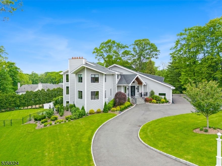 Designer Home 2.0!....Completely reimagined over the past few years this exceptional home features approx.8000sq.ft of living and entertaining space situated on one of Franklin Lakes most coveted streets.The layout of this beauty flows effortlessly & designed for everyday living and grand scale entertaining.This home welcomes you with a grand foyer leading to a central staircase adorned w/crown molding,tray ceilings and custom millwork throughout.Gourmet kitchen offers SS appliances,oversized Xtra deep Quartz center island, floor to ceiling custom cabinetry+ large covered balcony from kitchen & dining room. overlooking pool w/waterfalls.Additional adjacent flex space ideal for den or entertainment room.The open floor plan connects both dining and living room as well as the sun drenched Great Rm w/wet bar.Upstairs finds the lavish owners suite,balcony,multiple walk- in closets,LUXE spa like bath w/soaking tub.Additional 3 bedroom en-suites one w/ balcony completing the 2nd floor.The walk out lower level equally impressive boasts a spacious entertainment room w/stone FPL,wet bar,2 beverage centers along w/(3) sets of sliders to patio.Two additional bedrooms with sliding doors also which lead out to the private patio.Enjoy the ultimate backyard oasis with salt water gunite pool, spa, outdoor lounge areas and lush landscaping.Located in ansopught after neighborhood,low taxes and convenient access to dining, shopping and NYC. Don't miss this opportunity!