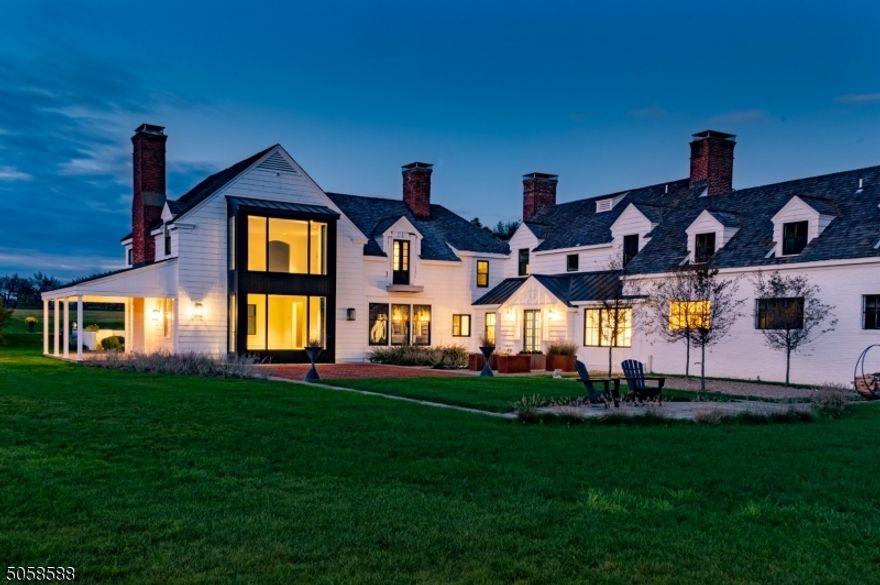 Indicative of regenerative organic farming principles, The Orchard Estate ties the beauty of traditional architecture with modern luxury. Overlooking incredible farm preserves for over 10 + acres. This one-of-a-kind custom-design highlights a true chef's kitchen dressed with state-of-the-art appliances by Sub Zero Wolf and romantic Italian porcelain. One-touch on your Savant systems mobile app controls lighting, heating, and cooling throughout the entire space. There are three owners' suites. Radiant heated flooring in the bath and spa rooms. A perfect scenario for an in-laws suite. The farm estate upholds a historical charm infused with new modern touches and endless private views overlooking a bucolic dream in a majestic equestrian country.