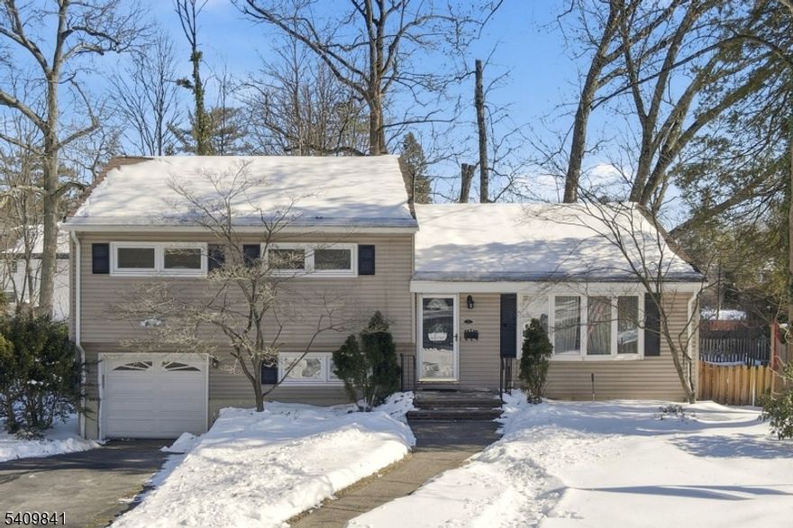 Location! Location! Location! Lovingly maintained 3-bedroom, 2.5-bath split-level home tucked away on a quiet cul-de-sac side street. Hardwood floors run throughout the light-filled living room and dining area, creating a warm and welcoming atmosphere. Sliders off the dining area lead to a deck overlooking the spacious, private and fenced rear yard! The eat-in kitchen offers a multitude of cabinets and generous counter space. The second level features a spacious primary bedroom with two closets and a full bath with shower stall, along with two additional bedrooms and a beautiful updated, full main bath. The ground level offers convenient access to the one-car attached garage, a comfortable family room with office nook, a powder room, and a door leading to the rear yard. The full, unfinished basement provides abundant storage, laundry, and utilities. Ideally located approximately one mile from Westwood's train station and its vibrant yet relaxed downtown, featuring restaurants, shops, and more! More than just a place to live, this one is "home"!