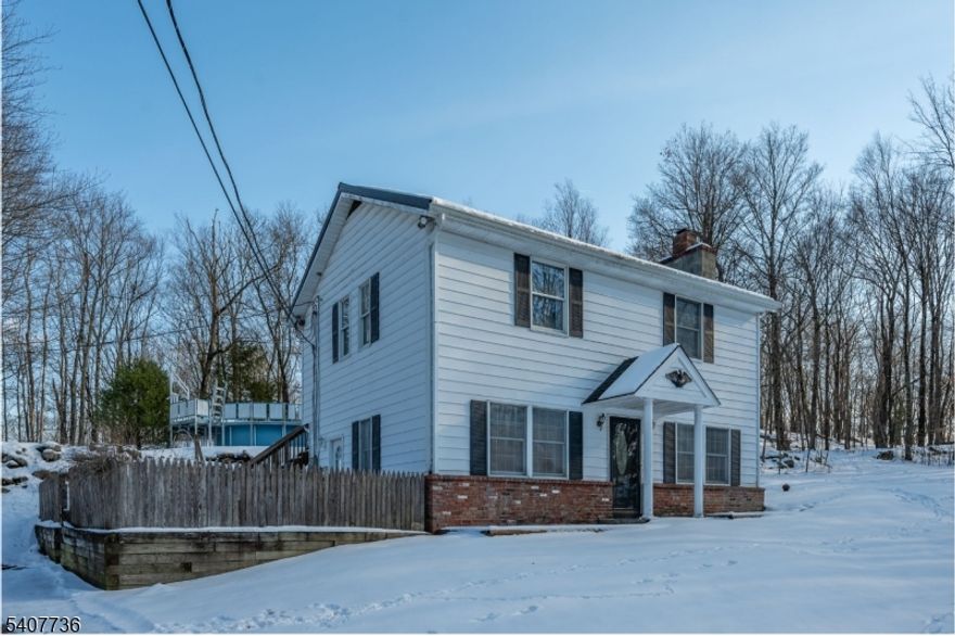 NESTLED IN NATURE IS THIS SPACIOUS, CLASSIC COLONIAL SET ON NEARLY 5 PASTURAL ACRES IN THE BUCOLIC ROLLING HILLS OF WANTAGE TOWNSHIP! BRIGHT & AIRY FLOOR PLAN FEATURES: NEW ROOF-2019, NEW FURNACE-2020, 3 GENEROUS BEDROOMS + 2 FULL BATHS, AN AMPLE LIVING ROOM WITH WOOD BURNING STOVE LEADING INTO AN INVITING DINING ROOM BOTH WITH 9 FT CEILINGS!  THE OVERSIZED GALLEY KITCHEN FEATURES A SIDE ENTRY, TRASH COMPACTOR & BREAKFAST BAR OPEN TO THE DINING ROOM WITH ALL APPLIANCES INCLUDED! ENJOY YOUR OWN PRIVATE COMPOUND VIEWS FROM THE EXPANSIVE DECK WITH A SUNSETTER AWNING & FENCED-IN SIDE YARD! CAR/WORKSHOP ENTHUSIASTS WILL APPRECIATE THE OVERSIZED, NEWER 24 X 24 TWO CAR DETACHED GARAGE WITH 100 AMP SERVICE! ADDITIONAL STORAGE IS MAXIMIZED WITH A 20 X 10 SHED! ROUNDING OUT THIS UNIQUE PROPERTY IS A SEPARATE PARKING AREA WITH 30 AMP SERVICE - PERFECT FOR YOUR RV OR BOAT!!! *POOL IS, "AS IS"***CHIMNEYS & WOOD STOVE ARE, "AS IS", NO KNOWN ISSUES"***LOW TAXES!!!