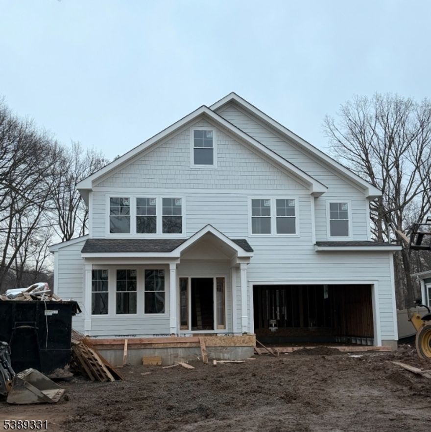 New Construction by New Providence's premier, award winning builder! This latest project features a superb layout with 6 BRs, 5 full baths, 2 car garage and finished basement with 9 ft. ceilings. Nestled in a highly desirable neighborhood, this quality built home will be a testament to luxury and craftsmanship with ample space for living & entertaining. The open concept gourmet kitchen will feature Thermador appliances, quartz counters, custom cabinetry and pantry. The luxurious primary suite will be a private sanctuary, complete with a spa-like bathroom & walk in closet. Additional features include a first floor bedroom and full bathroom, mudroom, butlers pantry/dry bar, 2nd floor laundry room with cabinetry & sink and spacious center island in kitchen. This 5160 sq. foot home is under construction, so there's still time for buyers to make some selections to personalize the home. Proximity to Oakwood Park with amenities like a playground, turfed fields, ice skating pond, picnic area, bocce court & wooded trails. True new construction with all new foundation. Builders 10 year warranty. Highly ranked New Providence public schools and an easy commute to NYC. Expected completion date is Spring 2026. Don't miss this opportunity!