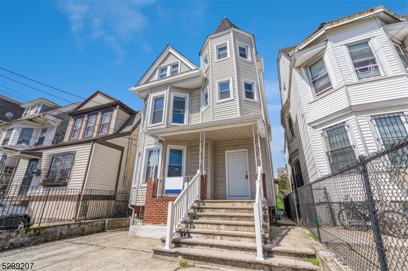 This beautifully rehabbed two-family home is an exceptional opportunity. Unit 1 features one bedroom, a living room, dining room, eat-in kitchen, bathroom and mudroom that provides easy access to the yard. Unit 2 offers two bedrooms, with main bedroom featuring a walk-in closet, living room, eat-in kitchen, and full bathroom. A back staircase provides access to both the backyard and unfinished basement, offering potential for storage or future customization, while a finished attic adds additional living space and separate bath. Both units have individual utilities and access to the large enclosed yard perfect for outdoor activities and entertaining. Gated two-car parking space for secure off-street parking. Ideally situated close to parks, restaurants, shopping, major highways, NYC transportation, MetLife Stadium, and the American Dream Mall, this home is in a prime location for commuters and those seeking vibrant local amenities.