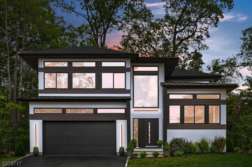 Ultra-contemporary NEW CONSTRUCTION  with 10 year warranty 6-bedroom, 5-bath home with a 2-car garage, a custom design-build by Exodus Development. A dramatic loft-style foyer with soaring ceilings and Anderson signature halo windows sets a bold architectural statement. The chef's kitchen showcases a complete Miele package and a 13-ft waterfall island with extraordinary finishes. Espresso-stained hardwood floors and natural wood accents create the perfect balance of warmth and modern elegance. All photos are real no renderings. 6 Melrose is a dream