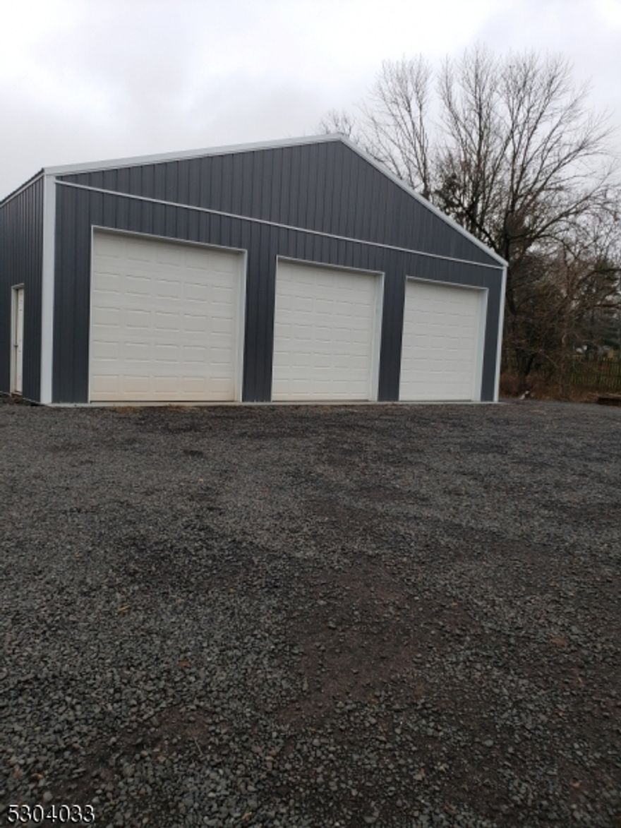 MAIN VALUE IS IN THE LAND.  A great property with many opportunities.  Possible sub division but variance required.  Buyer should check with Readington Township for possible other uses.  Detached garage is 40 x 40.  Property was approved in 2015 for condominiums but this approval must be confirmed by the buyer as it may have expired. 200 amp electric panel in the garage and in the house.