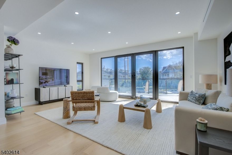 New Construction! Experience Unparalleled Luxury Living at The Seashore in Long Branch! Ride your private in-unit elevator up 4 levels to your expansive rooftop terrace & savor sweeping ocean views. Just minutes from the beach & Pier Village, this limited collection of 14 luxury townhomes offers close to 3,200 sqft of designer interior living space (+1108 SF outdoors) with 3 bedrooms + den, 3.5 baths, multiple balconies & a heated, EV charger ready garage. A modern masterpiece, each home features custom European windows and doors, open-concept living, and a chef's kitchen with premium smart appliances: Nostalgie by ILVE stove & SAVALO refrigerator and dishwasher.After a day at the beach, relax in the exclusive heated resort-style pool or explore the vibrant dining, shopping, and nightlife of Pier Village, Red Bank, Asbury Park, and Sea Bright, with NYC just a ferry ride away. Located minutes from the future home of Netflix, this is coastal luxury at its finest!