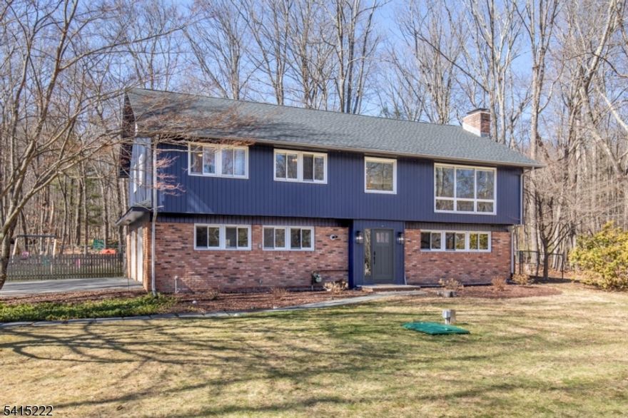 Located in an established Chester neighborhood with mature trees and spacious lots, this home offers a comfortable layout with thoughtfully updated living spaces. The renovated kitchen (2025) features white cabinetry, quartz countertops, a sleek full quartz backsplash, a large center island with seating, and a built-in beverage refrigerator. The kitchen opens to the family room with a gas fireplace and large windows that bring in natural light and views of the property. An eating area just off the kitchen includes a built-in bench with storage and offers a comfortable spot for dining, while a sliding door leads directly to the deck giving easy access to outdoor living. The deck overlooks the generous back yard, creating space to relax and enjoy the setting.This main level also includes the primary suite with a primary bath beautifully renovated in 2025, along with two additional bedrooms and a hall bath. The ground level provides additional living space with a living room featuring a second fireplace, along with a fourth bedroom and full bath.Additional recent improvements include refinished wood floors, a new roof (2023), and a new septic system (2023).Chester is known for its strong sense of community, highly regarded schools including an International Baccalaureate (IB) Diploma high school, a charming downtown, and access to numerous parks and preserved open space.