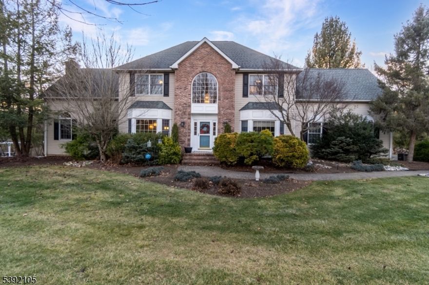 Welcome to this stunning 3,633 sf center-hall Colonial tucked at the back of the sought-after Kennedy Mills Estates neighborhood. Set on a premium 2.37-acre lot backing to the trout-stocked Pohatcong Creek, this home offers privacy while remaining conveniently close to I-78 and nearby NYC bus and train service for an easy commute. Built by the owners in 1997, this beautifully maintained 4-bedroom, 2 and a half bath home features a three-car garage with extended-height doors ideal for storage or multiple vehicles. Step inside to an inviting layout perfect for both everyday living and entertaining. The large eat-in kitchen has been updated with granite countertops, center island, five-burner gas stove, double wall oven, and stainless steel appliances. Rich hardwood floors flow into the formal dining room with bay window, while the two-story family room showcases a floor-to-ceiling brick wood-burning fireplace. The first floor also offers a possible work-from-home office, laundry room, powder room, and ample storage. Upstairs, the upgraded primary suite features tray ceiling, walk-in closet, and spa-like bath with double sinks, jetted tub, and fully tiled shower. Three additional bedrooms and full bath complete the second level. The basement offers high ceilings, sliding glass door, and finished room ideal for home office, gym, or lounge. Outdoor living feels like a weekend retreat with an oversized deck, retractable awnings, heated saltwater pool, patio, and landscaped gardens.
