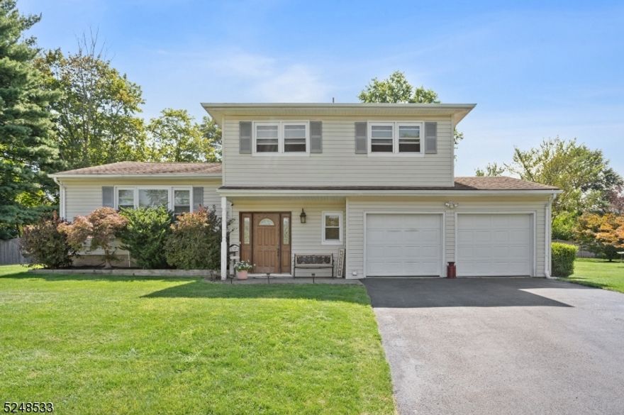 Welcome home. This beautiful split-level home on cul-de-sac will not disappoint. From the moment you enter you can feel pride in ownership. The light bright foyer offers a half bath, laundry room and access through to the family room equipped with sliders to the patio and back yard. The main level is comprised of a living room and dining room both with hardwood floor and tons of natural light. Moving through to the kitchen you have custom cabinetry, Stainless Steel appliances and granite counter tops. At the opposite end of the kitchen is a perfect spot for a table and chairs overlooking the back yard. Rounding out this level is a beautiful sunroom overlooking the pool and decks. The second floor has three generous bedrooms with the primary offering a walk-in closet and full bath. To round out the house there is a lower-level den with storage. Moving outside you will find a large level yard with an above ground pool, patio with motorized awning, decks for grilling and a generous 2 car garage. Will not last!