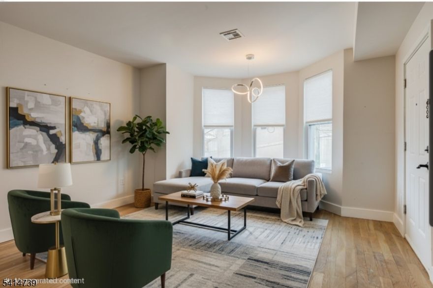 This exceptional two-family home in the vibrant community of Union City offers a generous backyard and limitless potential. Bathed in natural light from expansive windows and complemented by bright, modern finishes, each beautifully renovated unit features two spacious bedrooms and two full bathroom.  The second-floor apartment also includes a loft on the third level, providing additional versatile living space. Meticulously redesigned with architectural flair and contemporary upgrades, this property seamlessly blends style, comfort, and functionality creating an elevated living experience for both owners and tenants.   The expansive backyard serves as a private retreat, perfect for gardening, outdoor dining, entertaining, play, or simply relaxing in your own outdoor oasis. Ideally located just moments from premier transportation to New York City, this home provides outstanding accessibility while remaining nestled in a neighborhood known for its strong sense of community and rich history. With convenient access to public transportation and major highways, commuting to NYC or working remotely is effortless.   Surrounded by local restaurants and shopping, this property offers the perfect balance of comfort, convenience, and urban lifestyle.