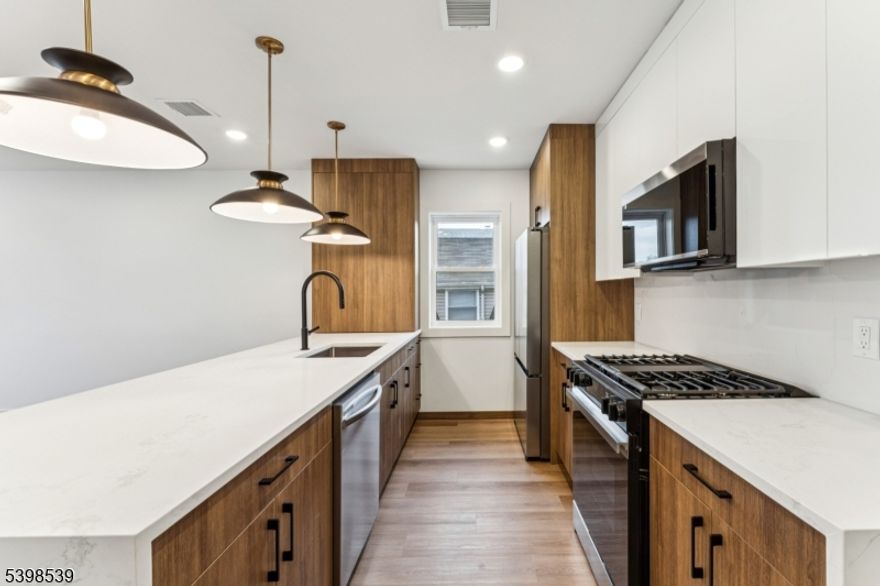 The universe has decided to be generous to apartment hunters with 84 Hollywood Ave, Unit 2! Everything in this brand-new 2025 construction is bright and clean, with no mysterious stains in sight. The one-level layout flows effortlessly, anchored by a kitchen with sparkling stainless-steel appliances, plus a dishwasher for settling dish disputes without a word. Each of the three bedrooms has closets spacious enough to double as side quests. Two full bathrooms help maintain peace on tight schedules, and an in-unit washer and dryer keep laundry pleasantly uneventful. Outside, a huge shared backyard offers room to ponder starting a garden or bask in the day. Ring doorbell security adds to the peace of mind, and the location supplies easy access to the Parkway, 280, NJ Transit buses, a local gym, and places of worship. Unit 2 brings peace of mind to the apartment hunt. Inquire today!