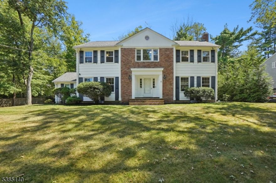 Situated on a half-acre of beautifully landscaped property, this high-end home enjoys a prime spot in the desirable Hartshorn neighborhood. This center hall Colonial home features 4 bedrooms, 3.1 bathrooms, is thoughtfully designed, and provides the right flow for seamless indoor /outdoor entertaining. Enter the home through its elegant foyer, spacious living room with fireplace, dining room and sun--filled family room with large sliding door to backyard, gourmet eat-in kitchen with SS appliances. 1st floor laundry room and mud room. Attached two car garages connect to kitchen providing the convenience of in and out. The 2nd floor offers a master suite including updated spa-like bathroom with free standing bathtub, big standing shower and double sink vanity, and walk-in closets. There are three additional spacious bedrooms and full bathroom.  Completing the home is a finished and spacious lower level with high ceiling, two separate staircases for convenience, provides additional space for family room, home theater, playroom and full bathroom.  This incredible home is located just minutes from Millburn's top-rated schools, renowned downtown, short distance to NJT train station.