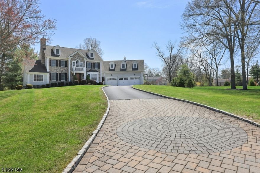 Situated on a cul-de-sac and over 4500 sqft (per tax assessor), this stunning colonial is where luxury and comfort come together in perfect harmony. Step inside to an open and airy floor plan, highlighted by a grand 2-story foyer with a marble floor that welcomes you into the home. The gourmet kitchen is a chef's dream, featuring a spacious center island, pantry, and breakfast area. A back staircase leads to the second floor for added convenience. The living room and dining room are accented with custom moldings, while the living room also boasts a cozy gas fireplace, perfect ambiance for entertaining. The family room showcases coffered ceilings and a floor-to-ceiling wood-burning fireplace, creating a warm, inviting atmosphere. Relax in the sunroom, a serene retreat with a wall of windows that bring the outdoors in. The office, with a trey ceiling and French doors, offers a quiet and sophisticated workspace. The large primary suite includes a walk-in closet and a spa-like bath with a stall shower, jetted tub, and private water closet. Four additional bedrooms, including one with an en suite bath and two others with a Jack-and-Jill bath, offer comfort and flexibility - potentially servings as an in-law suite. The finished basement adds to the living space with a media room, game area, and exercise area. Step outside to the paver patio off the kitchen, overlooking the open level lot ideal for enjoying the outdoors. Golfers enjoy the heated garage and golf simulator year round!