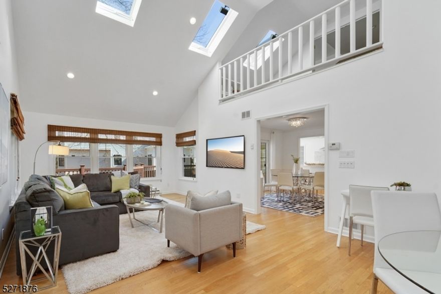 Exquisitely renovated with attention to every detail, this gorgeous split level enjoys a prime spot in the Hartshorne Poet section, one of Short Hills' premier neighborhoods. This location is close to Hartshorn and Pingry schools, shopping, recreation, and NYC transportation. On the edge of a cul de sac, this house showcases the open-concept floor plan with high ceilings and gleaming wood floors.  Anyone who loves to entertain will be thrilled with the easy flow from the living Room, to the formal dining room, huge family room, and chef's kitchen, with an oversized breakfast area and sliders to a huge deck overlooking the 0.5-acre property. The newly renovated kitchen features Poggenpohl cabinets, Thermador stainless steel appliances, a built-in coffee maker, under counter microwave, unique translucent Onyx counters and a backsplash.  Located on the second and third levels are a total of 4 bedrooms and two wonderfully renovated bathrooms. The renovated primary suite includes a spacious bedroom, a large closet, and an ensuite bath with both shower and soaking tub which is made from imported natural pine wood from Japan. The ground level has a powder room and a mud room connecting to the garage. The finished basement includes a recreation room, a full bath, and a modern wine cellar. Requiring only your personal touch, this exceptional home is ready for you to move right in and enjoy!