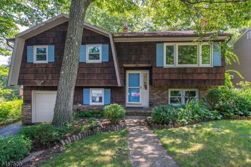 Immaculate, Bi-Level. Located on a wooded, private lot in White Meadow Lake. Seasonal lake views! Lots of Generous Room Sizes to Spread Out & Make Your Own! Layout offers versatile options! GREAT house for entertaining or everyday living. Beautiful HW Floors. Bright, open living space.  Large living room w/big picture window. Renovated kitchen w/SS appliances & separate dining area. 3 large bedrooms & full bath upstairs. 4th bedroom on lower level. Fully equipped with 2nd bath, family room, office space & laundry/mudroom that walks out to the backyard. 1 car garage. Backyard is large, wooded and private. Perfect spot to enjoy nature, mature trees/perennials, lawn, landscape & garden- relaxing! Large deck! An ideal spot to relax & enjoy life. Enjoy Lake Life, clubhouse activities, beaches, boating, swimming, pools, tennis courts, etc! Just a short drive to the Mall, bustling DWTN Denville, NYC Direct Mass Transit & easy access to major highways such as 80, 10, 46 & 287. Top rated schools. NEW Central Air (less than 1 year old)