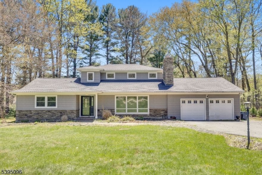 Modern updated expanded ranch set far back from the road with flexible primary suite on 1st floor or 2nd floor offers neutral colors, upgrades galore, finished basement, deck overlooking private fenced yard and so much more! Tremendous commuter location - minutes to Rts. 80, 10 and 46, shopping and dining within 5 minutes and excellent schools. A covered front porch leads to foyer area and living room with woodburning fireplace and hardwood flooring open to formal dining room and white kitchen with Quartz counter tops and stainless appliances, including 6 burner commercial type range, Thermador refrigerator, wall ovens, range hood, warming drawer and more. Adjacent to the kitchen is a four season sunroom/breakfast area, convenient laundry room and comfy family room. Primary suite with full bath, two additional spacious rooms and full bath complete the main living floor. 2nd floor offers second potential primary suite with adjacent office and walk-in attic through huge walk-in closet. The unfinished basement features a semi-finished area with closets and huge unfinished space with utilities and storage area, as well as Bilco doors to backyard. Deck and fireplace sold as-is with no known issues.