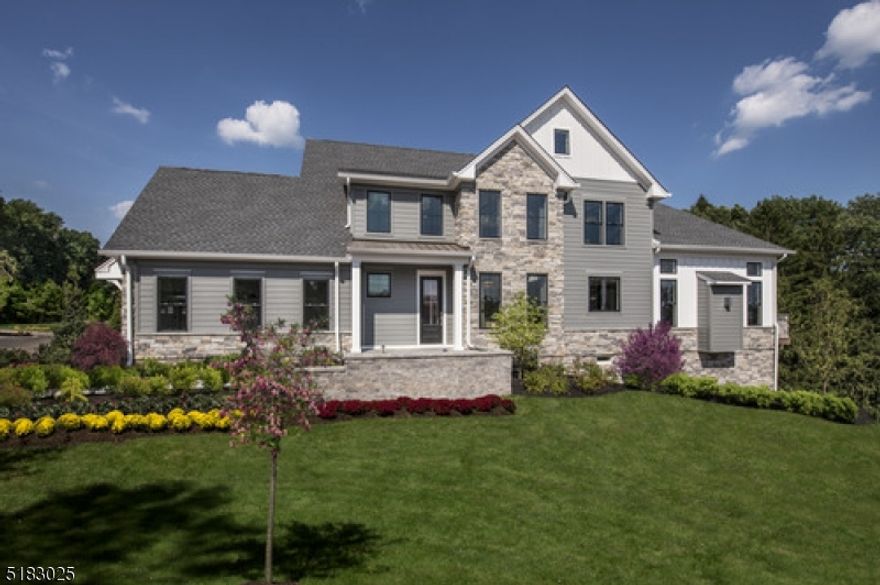 Decorated Model Home, move right in, all furnishings included! The striking two-story foyer offers sweeping views of the great room just beyond. A chef's dream kitchen comes complete with stone countertops, stainless appliances, and gas cooktop. As the centerpiece of the home, the open-concept great room is highlighted by gorgeous hardwood floors and convenient access to the covered outdoor patio. The primary bedroom suite is tucked away on the main floor, for a more intimate, private setting. Entertain in the finished lower level complete with a wet bar, bathroom, and living space.  Incredible view, wooded setting and drenched with south sunlight.